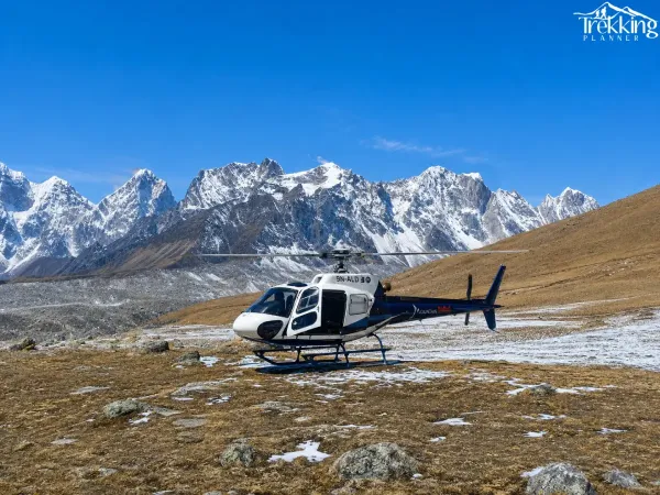 Mountain Helicopter Above Snowy Peaks