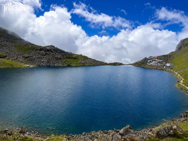 Mountain Lake With Colorful Shoreline Settlement