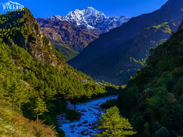 Snow Capped Peak Over Alpine Valley