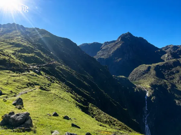 Sunlit Alpine Valley Panorama