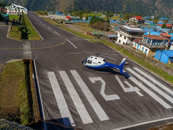 Helicopter landing at Lukla airport during a scenic flight from Kathmandu