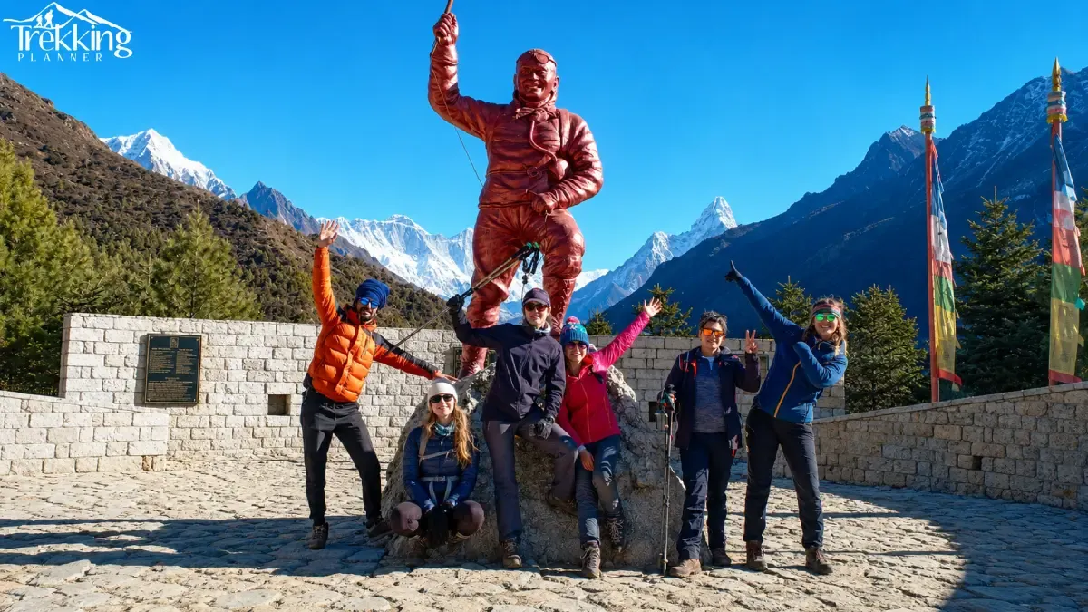 celebratory-hikers-beneath-himalayan-peaks
