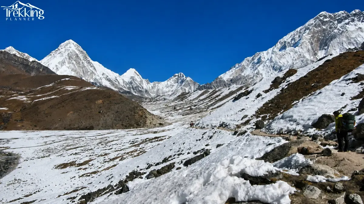 hiker-in-a-snowy-alpine-valley