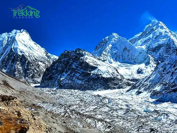 Panoramic view of snow-covered Kanchenjunga mountain range during North Base Camp Trek