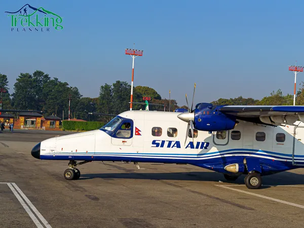 Kathmandu to Lukla flight aircraft flying over Himalayan mountains showing air fare travel route in Nepal