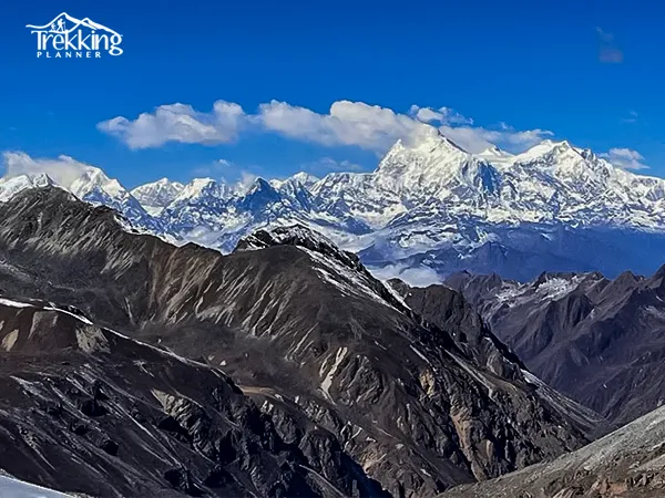 Trekkers crossing snowy Lumba Sumba Pass in challenging Himalayan conditions