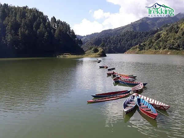 Hikers enjoying lakeside views at Markhu near Indra Sarovar Lake during a Chitlang trek