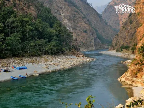 Group of tourists rafting through rapids on Modi Khola River in Pokhara region Nepal