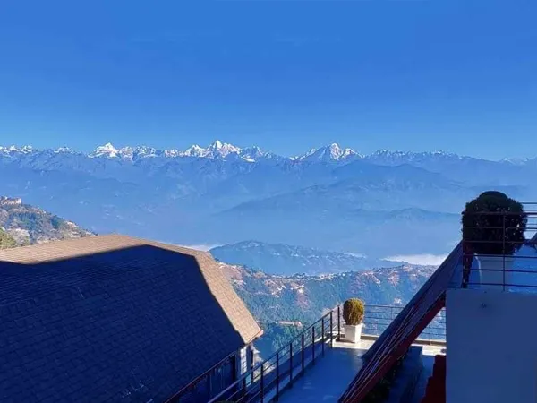 Hikers walking along the scenic Nagarkot to Sankhu hiking trail with panoramic Himalayan views in Nepal.