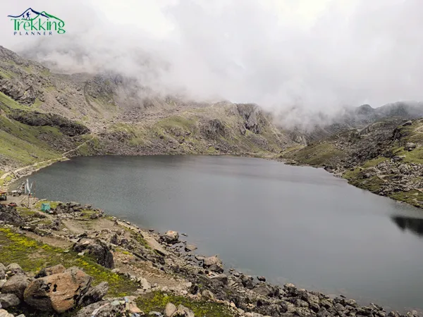 Sacred Gosainkunda Lake surrounded by snow-capped peaks on the Langtang Valley trekking route