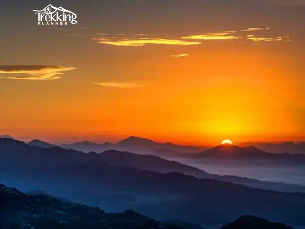 Sarangkot sunrise view overlooking Pokhara city, Phewa Lake, and the Annapurna mountain range during an early morning tour.