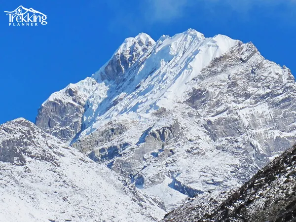 Sunrise over Lobuche Peak showcasing Mount Everest, Nuptse, and surrounding Himalayan peaks during the trek